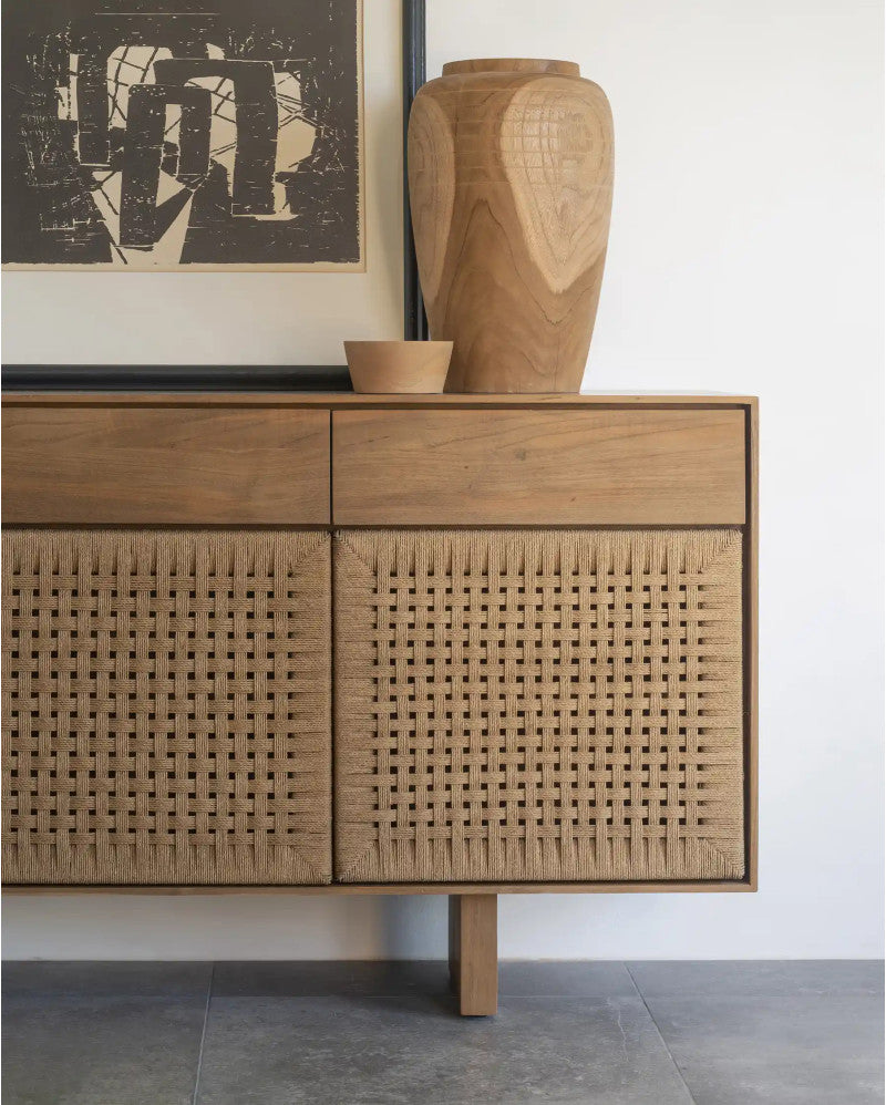 Wooden sideboard with wicker doors in a room setting