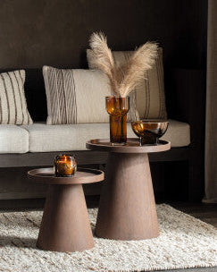 Living room with a sofa, coffee table, and decorative items.